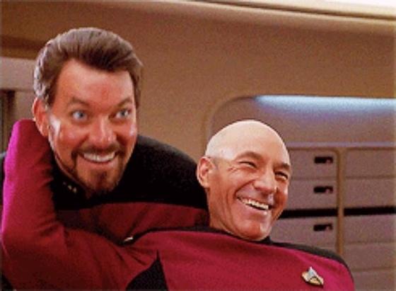 Riker and Picard laughing meme screenshot. Picard has his arm back grabbing Riker.